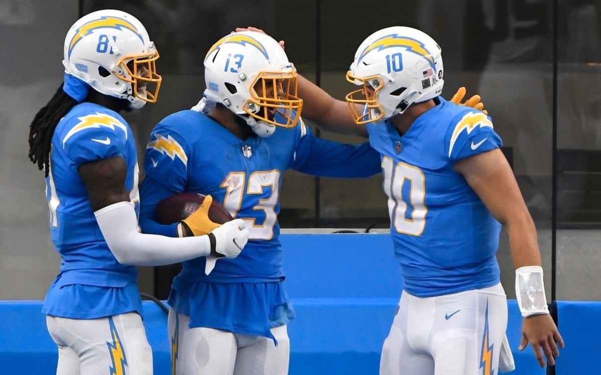 Los Angeles Chargers wide receiver Keenan Allen (13) celebrates with quarterback Justin Herbert (10) and wide receiver Mike Williams (81) after a touchdown in 2020. (Robert Hanashiro-USA TODAY Sports)